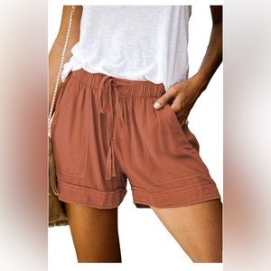 Size Small, rust orange/salmon causal shorts with drawstring. Never worn!
